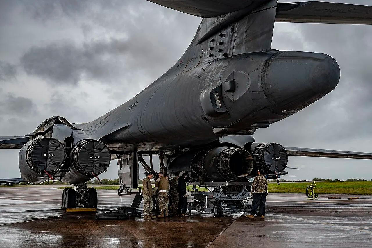 US airmen change an engine on a B-1 Lancer bomber at RAF Fairford, England, in November 2023.