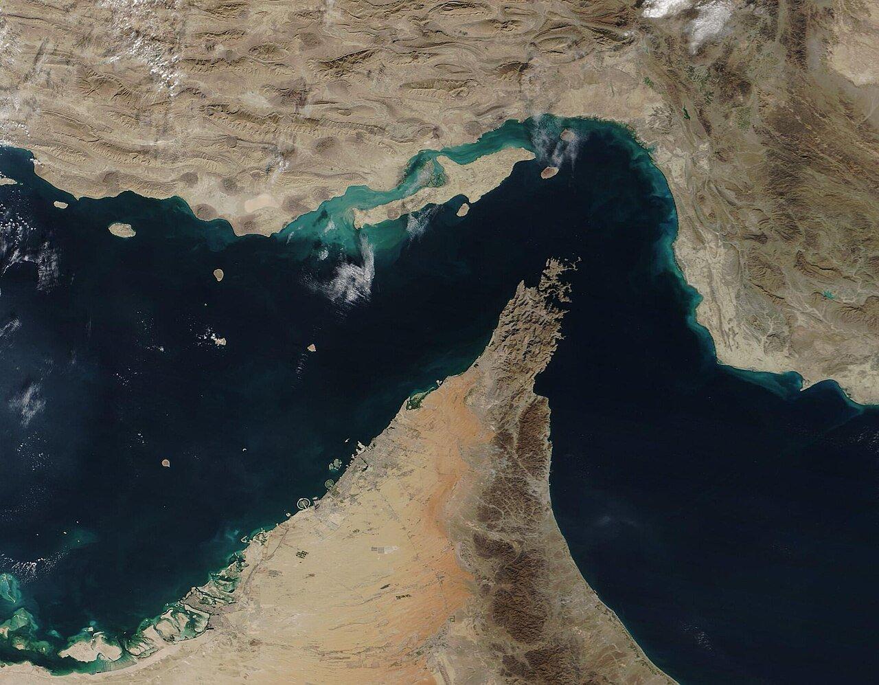 A satellite image of the Strait of Hormuz, between Iran (north) and the Arabian Peninsula (south), captured by NASA's MODIS sensor in December 2020.