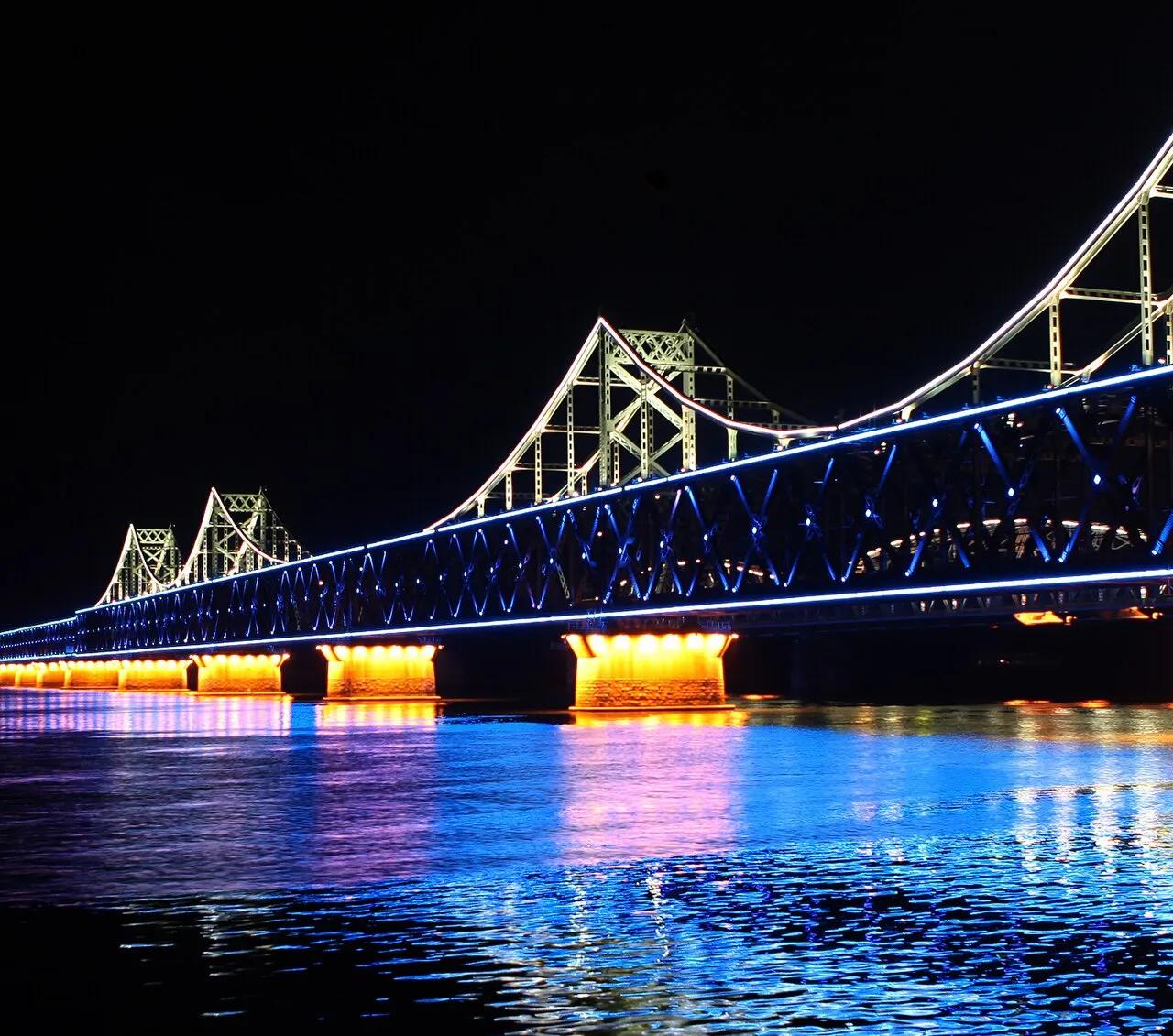 The Sino-Korean Friendship Bridge over the Yalu River, linking Dandong, in China, to Sinuiju, in North Korea, seen from the Chinese side in 2011.