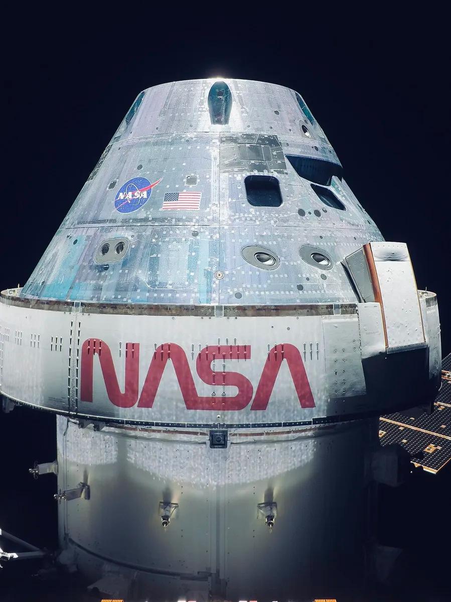 The uncrewed Orion capsule photographed by its own solar array camera halfway to the Moon during the Artemis I mission, in November 2022.