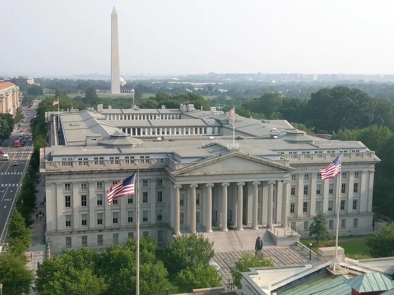 The Treasury Department building in Washington, D.C., with the Washington Monument behind it, in 2015.
